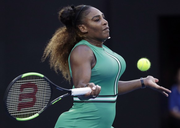 United States&#039; Serena Williams makes a forehand return to Romania&#039;s Simona Halep during their fourth round match at the Australian Open tennis championships in Melbourne, Australia, Monday,  ...