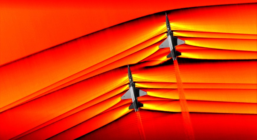 epa07421025 An undated handout photo made available by NASA photo shows two T-38 aircrafts in supersonic speed with shockwaves around them, at NASA’s Armstrong Flight Research Center in Edwards, Calif ...