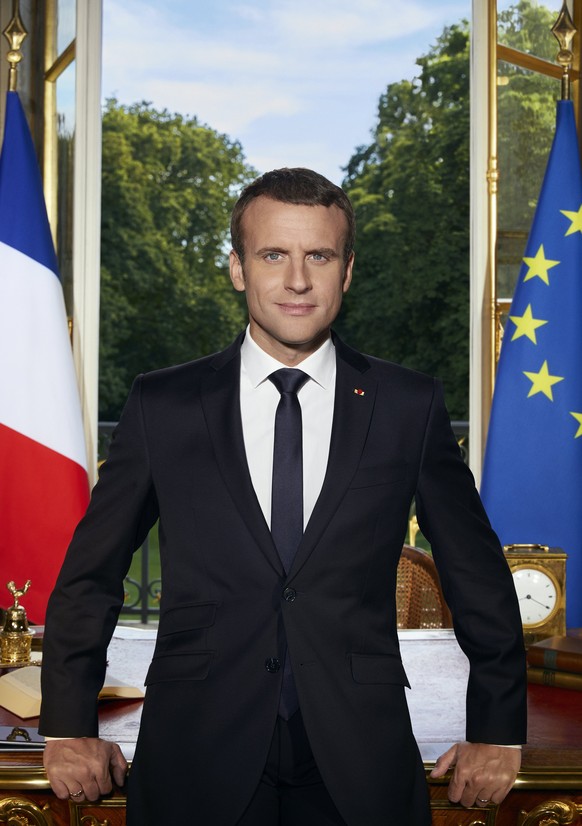 epa06055757 A handout picture provided by the Elysee Palace on 29 June 2017 shows the official portrait of French President Emmanuel Macron by French photographer Soazig de la Moissonniere, in Paris,  ...