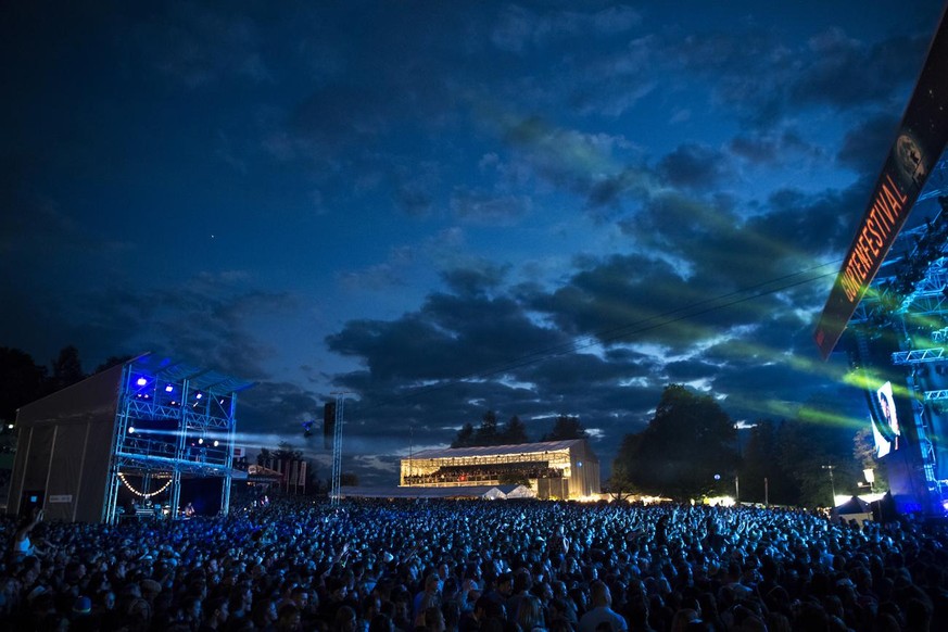 Festival goers enjoy the concert of the US band Imagine Dragons on the Hauptbuhne stage during the 34st of the Gurten music open air festival in Bern, Switzerland, this Thursday, July 13, 2017. The op ...