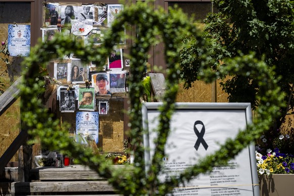 Portraits of the young victims are displayed at the entrance of the bar "Le Constellation" six moths later the deadly fire, in Crans-Montana, Switzerland, Thursday, July 9, 2026. Forty-one p ...