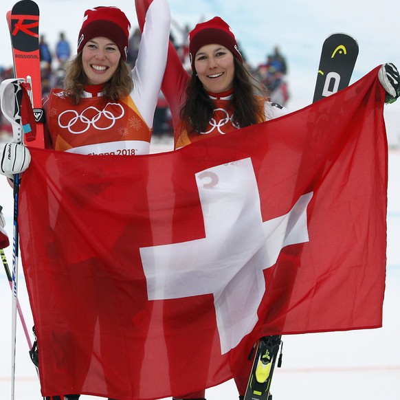 Silver medal winner Mikaela Shiffrin, left, of the United States, poses with gold medal winner Michelle Gisin, center, of Switzerland, and bronze medalist Wendy Holdener, also of Switzerland, during t ...