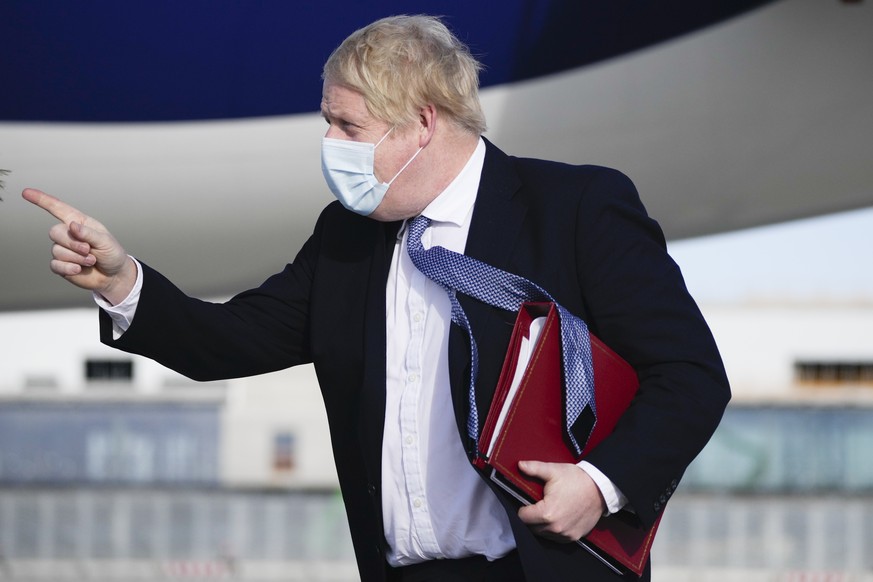 British Prime Minister Boris Johnson arrives for the Munich Security Conference in at the airport in Munich, Germany, Saturday, Feb. 19, 2022. (AP Photo/Matt Dunham, Pool)