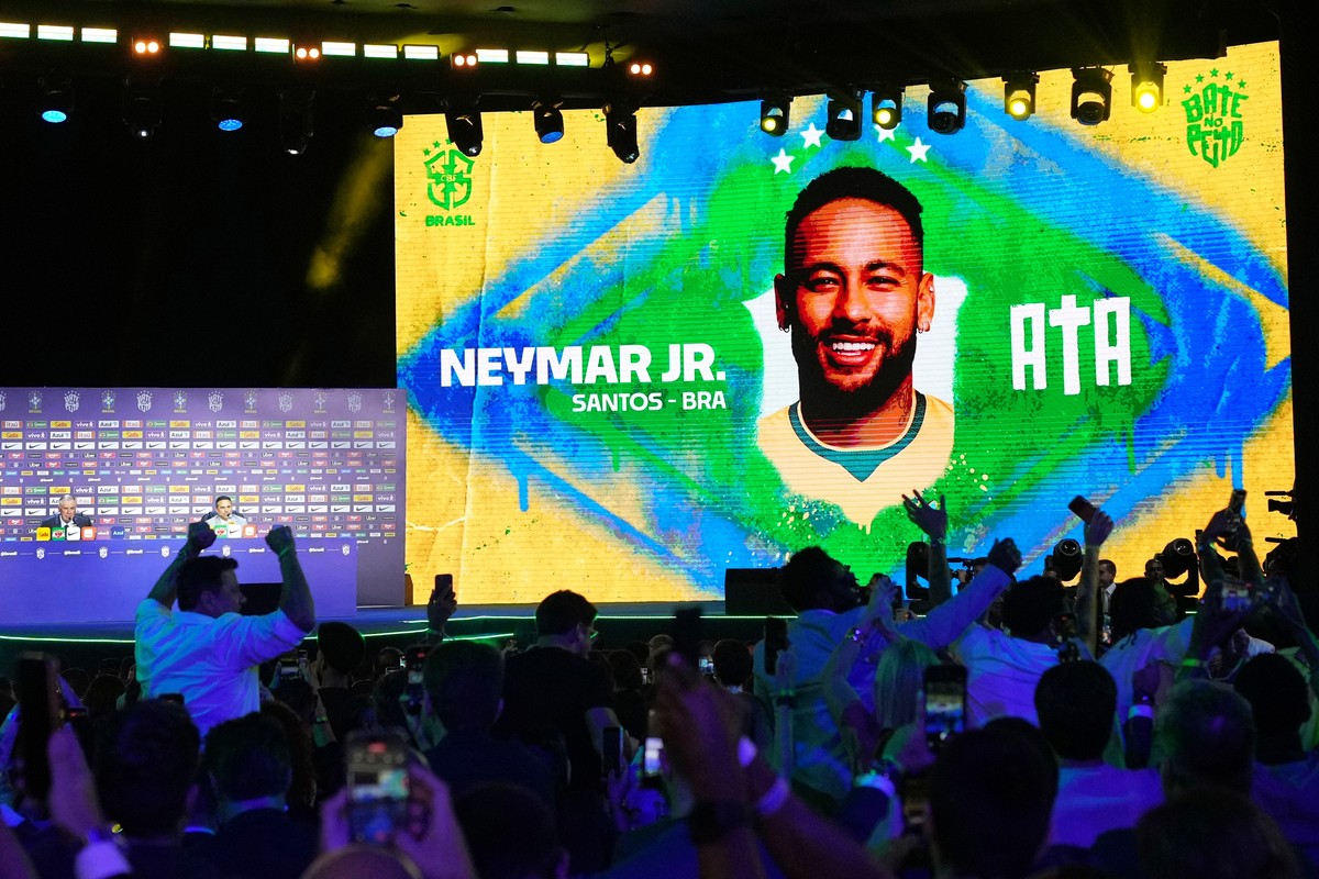A screen displays an image of Neymar after coach Carlo Ancelotti, left, included him in Brazil's squad for the 2026 FIFA World Cup in Rio de Janeiro, Monday, May 18, 2026. (AP Photo/Silvia Izquie ...