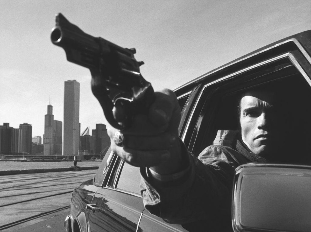 Actor Arnold Schwarzenegger films a scene for the film 'Raw Deal' in Chicago, 1986. (Photo by Juergen Vollmer/Popperfoto/Getty Images)