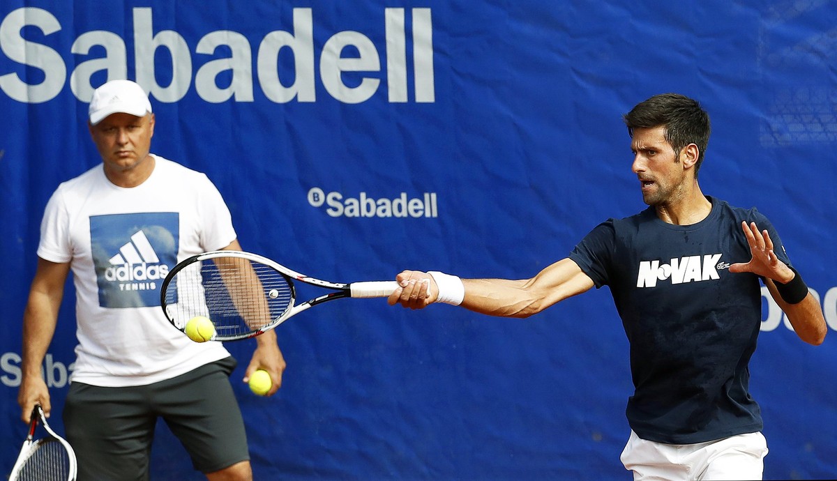 epa06687410 Serbia's Novak Djokovic (R) and his new coach Marian Vajda (L) attend a training session for the Barcelona Open Trofeo Conde de Godo tennis tournament in Barcelona, Spain, 23 April 20 ...