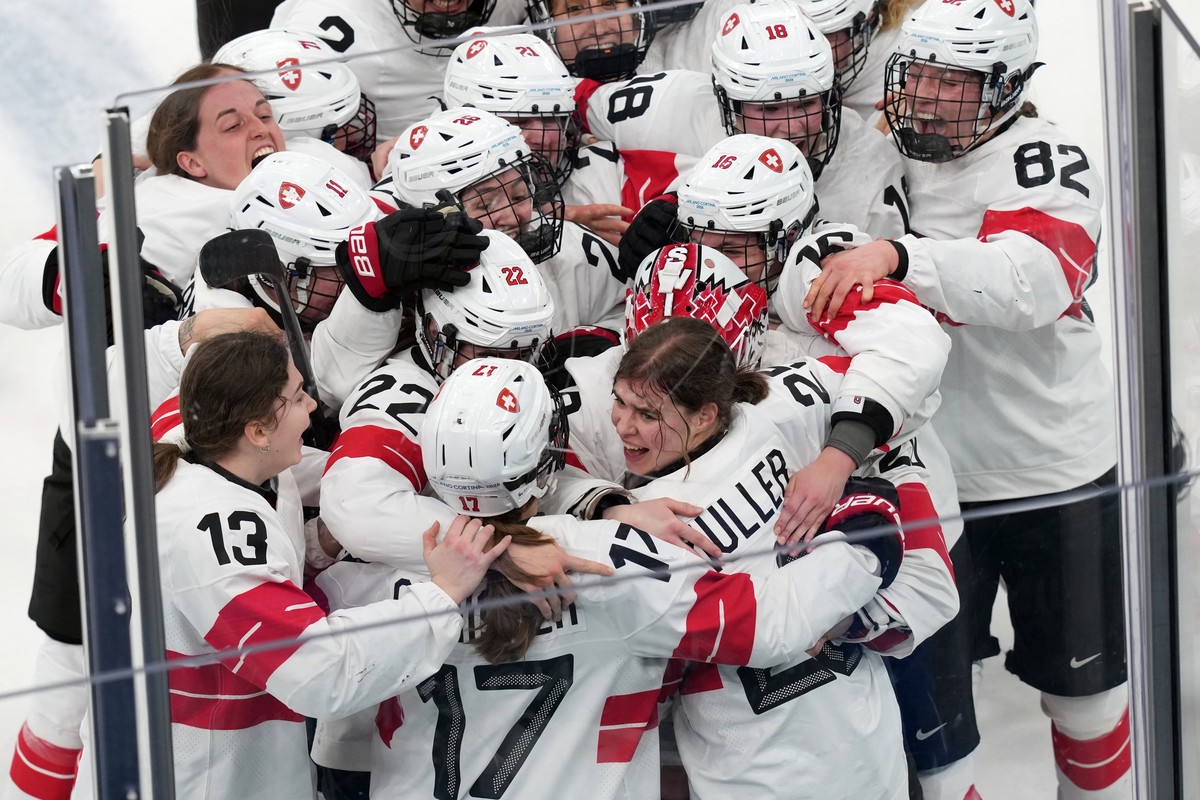 KEYPIX - Team Switzerland players celebrate after Alina Muller (25) scored the winning goal in overtime to beat Sweden in the women's ice hockey bronze medal game at the 2026 Winter Olympics, in  ...