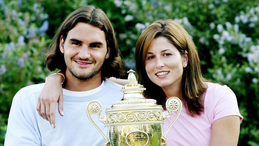 Roger Federer shares the limelight with girlfriend, Mirka Vavrinec after winning the 2003 Wimbledon Men&#039;s singles Championship. Federer beat Mark Philippoussis 7-6 (7-5), 6-2, 7-6 (7-3). (Photo b ...