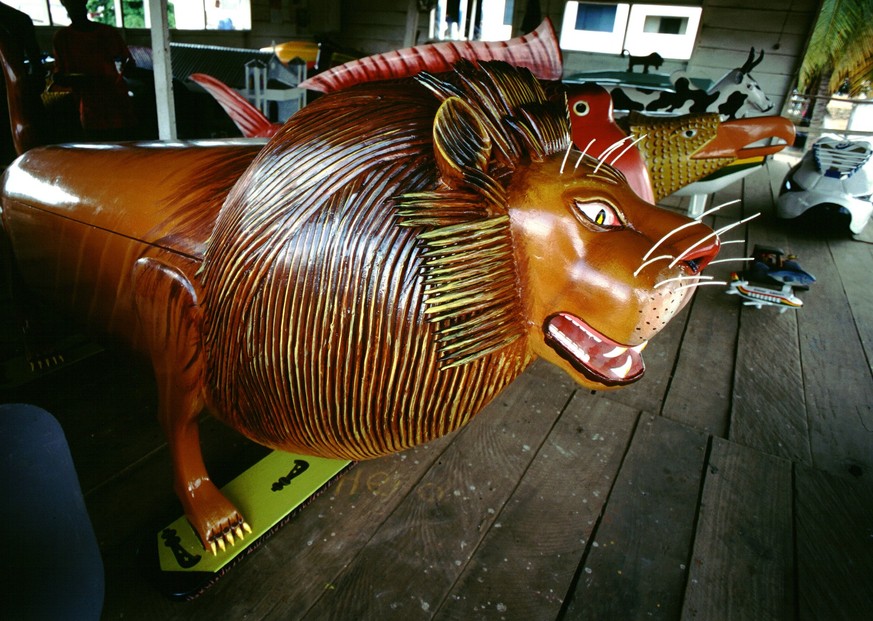 Coffin in the shape of a lion. The fantasy coffins of Teshie-Nungua. Among the Ga people, those of nobility and wealth often choose to be buried in whimsical coffins made in the form of animals and ma ...
