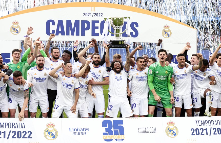 In this photo provided by the Spanish Royal Football Federation, Real Madrid player Marcelo lifts the trophy celebrating the team&#039;s La Liga title after a Spanish La Liga soccer match between Real ...