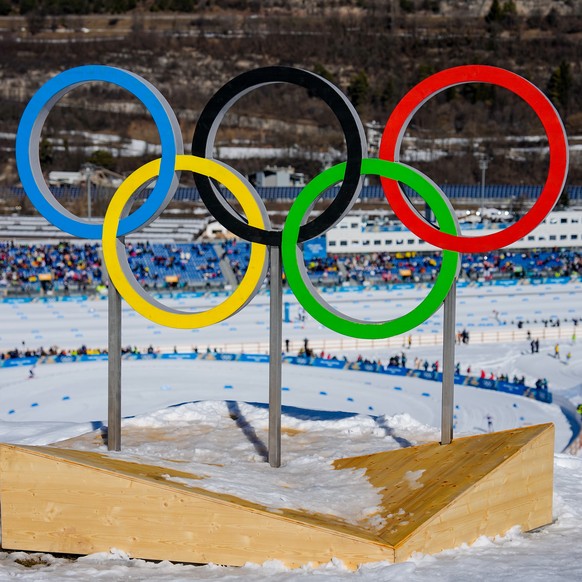 The Olympic rings stand above the course during the cross country skiing women's 50km mass start classic at the 2026 Winter Olympics, in Tesero, Italy, Sunday, Feb. 22, 2026. (AP Photo/Matthias S ...