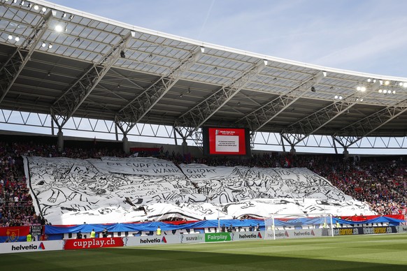 Fans spread a large banner claiming the final to take place in Bern, ahead of the Swiss Cup final soccer match between FC Basel 1893 and FC Sion at the stade de Geneve stadium, in Geneva, Switzerland, ...