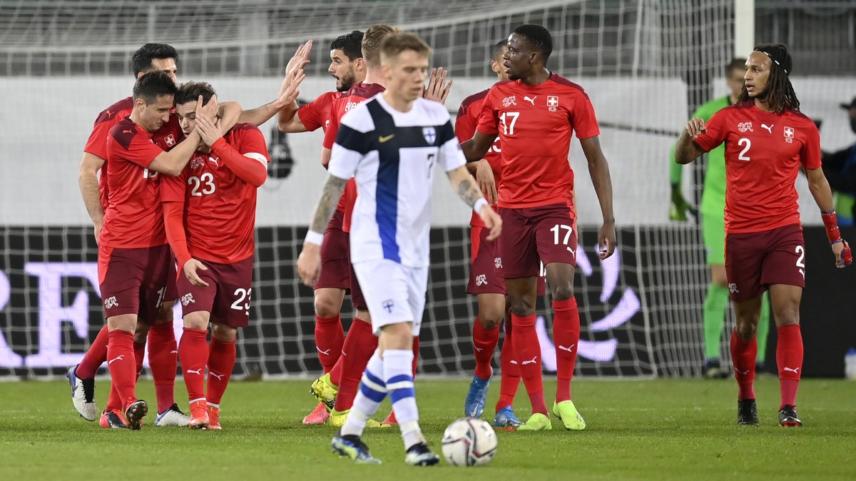 Switzerland's players with scorer Mario Gavranovic and captain Xherdan Shaqiri, from left, cheer after scoring during a friendly soccer match between Switzerland and Finland, at the Kybunpark sta ...