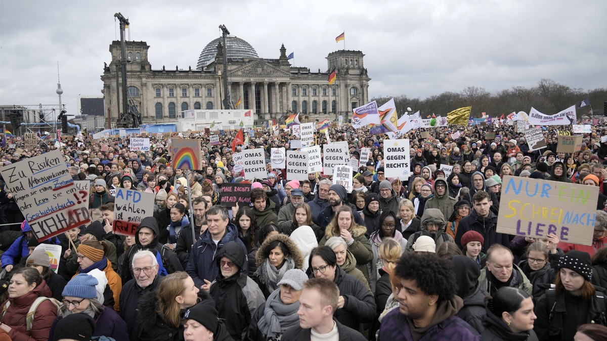 People protest in front of Germany's parliament Reichstag at a demonstration against the AfD party and right-wing extremism in Berlin, Germany, Saturday, Feb. 3, 2024 (AP Photo/Ebrahim Noroozi)