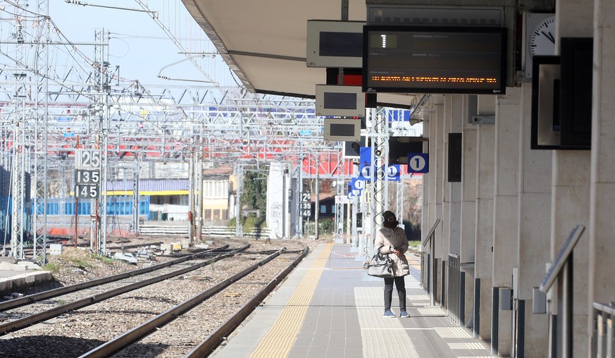 epa08278225 The nearly-deserted train station in Brescia, Italy, 08 March 2020. The Italian authorities have taken the drastic measure of shutting off the entire northern Italian region of Lombardy â? ...