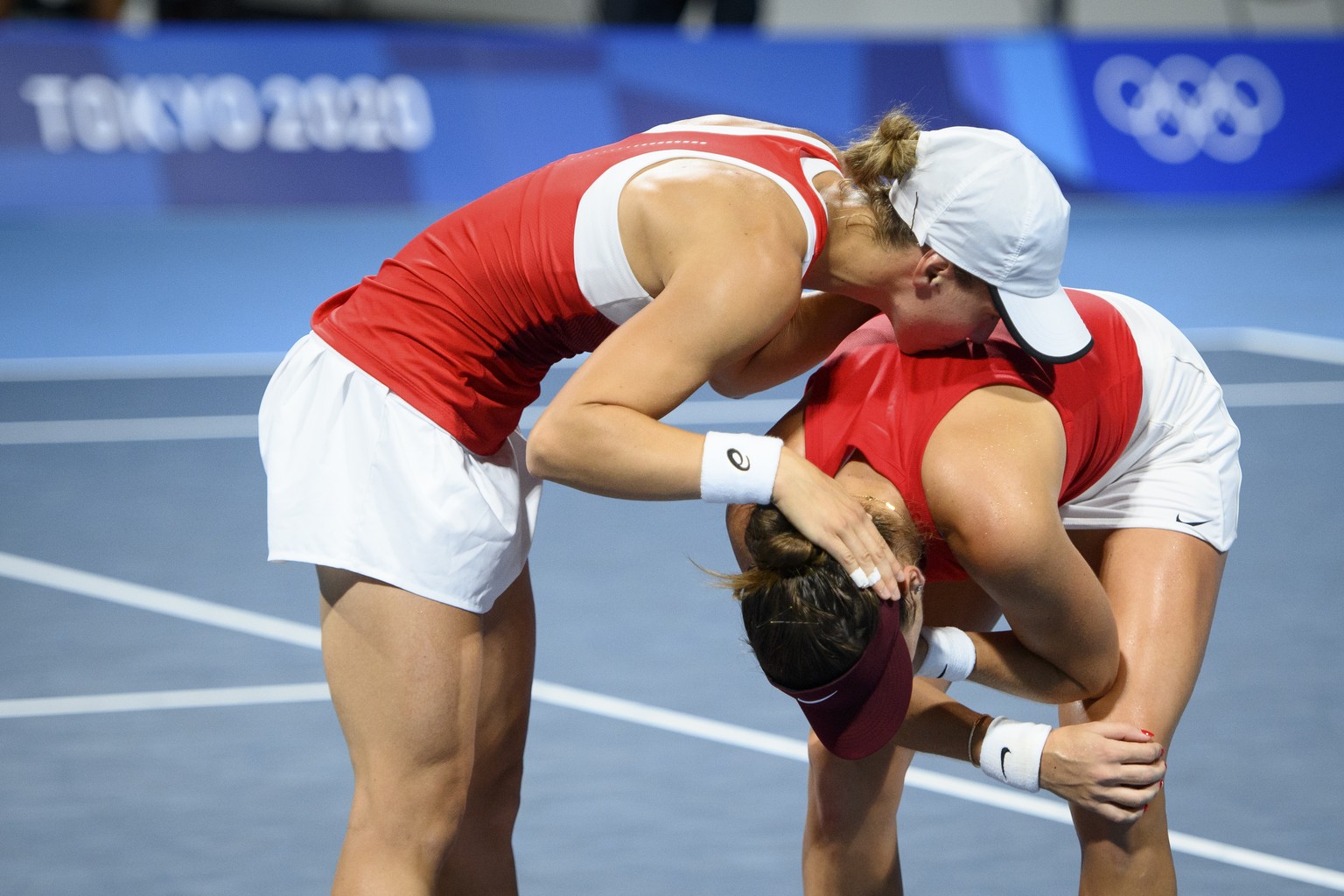 Belinda Bencic, right, and Viktorija Golubic, left, of Switzerland celebrate after winning against Laura Pigossi and Luisa Stefani of Brazil during the women&#039;s doubles tennis semifinal at the 202 ...