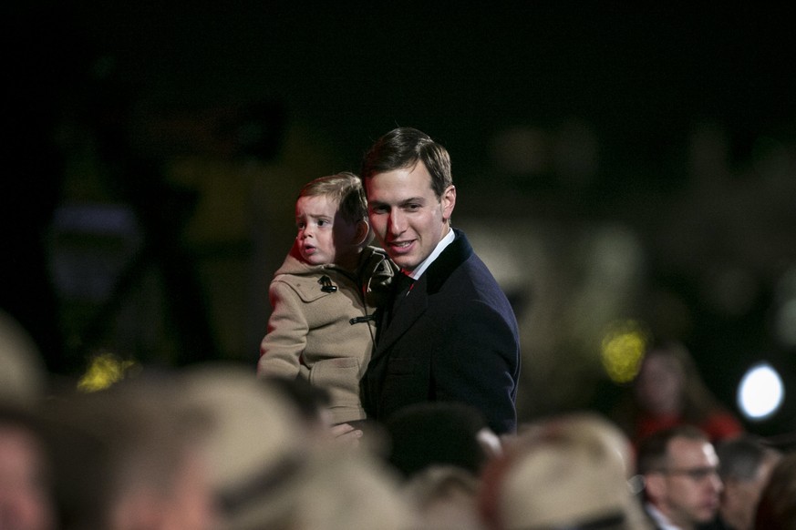 epa06360375 Jared Kushner, senior White House adviser, departs with his son Theodore Kushner, during the lighting ceremony for the 2017 National Christmas Tree on the Ellipse near the White House, in  ...