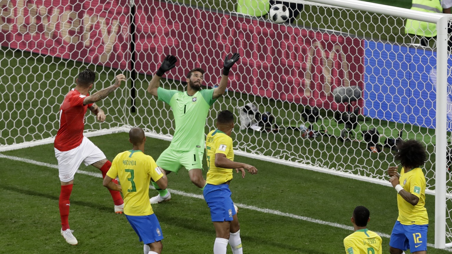 Switzerland&#039;s Steven Zuber, left, scores his side&#039;s first goal during the group E match between Brazil and Switzerland at the 2018 soccer World Cup in the Rostov Arena in Rostov-on-Don, Russ ...