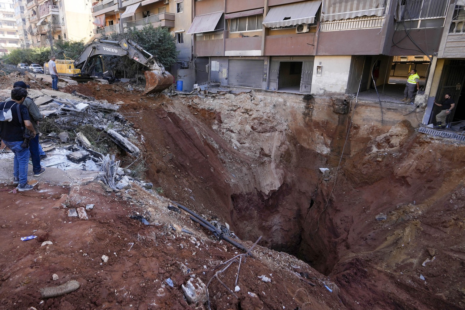 A hole in the ground near the site of the assassination of Hezbollah leader Hassan Nasrallah in Beirut&#039;s southern suburbs, Sunday, Sept. 29, 2024. (AP Photo/Hassan Ammar)