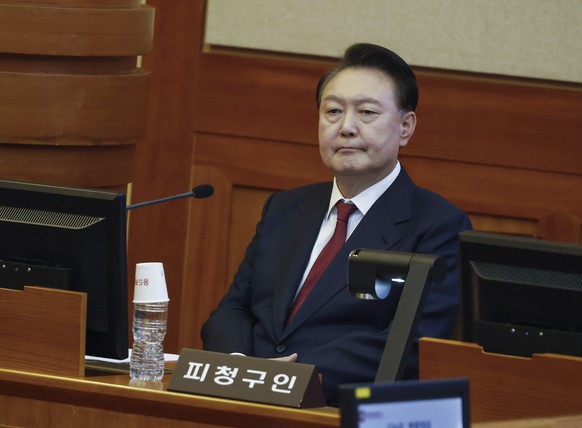 FILE- South Korea&#039;s impeached President Yoon Suk Yeol attends the fourth hearing of his impeachment trial over his short-lived imposition of martial law at the Constitutional Court in Seoul, Sout ...