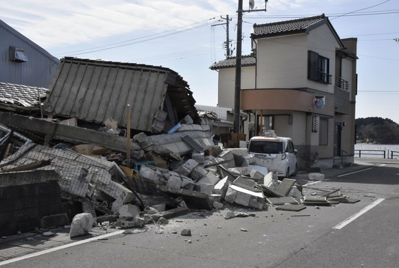 Debris from a destroyed building is seen following an earthquake in Soma, Fukushima prefecture, northern Japan Thursday, March 17, 2022. A powerful earthquake struck off the coast of Fukushima in nort ...