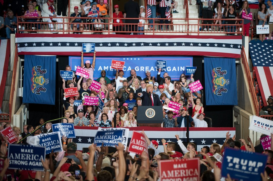 epa05936313 US President Donald J. Trump (C) speaks at the Pennsylvania Farm Show Complex in Harrisburg, Pennsylvania, USA, 29 April 2017. The rally marked the president&#039;s 100th day in office. EP ...