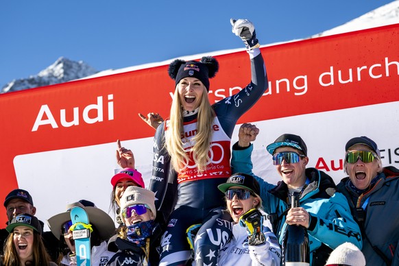 Second placed Lindsey Vonn of the United States celebrates with US's team members after the podium ceremony of the women's Downhill race at the Alpine Skiing FIS Ski World Cup, in St. Moritz ...