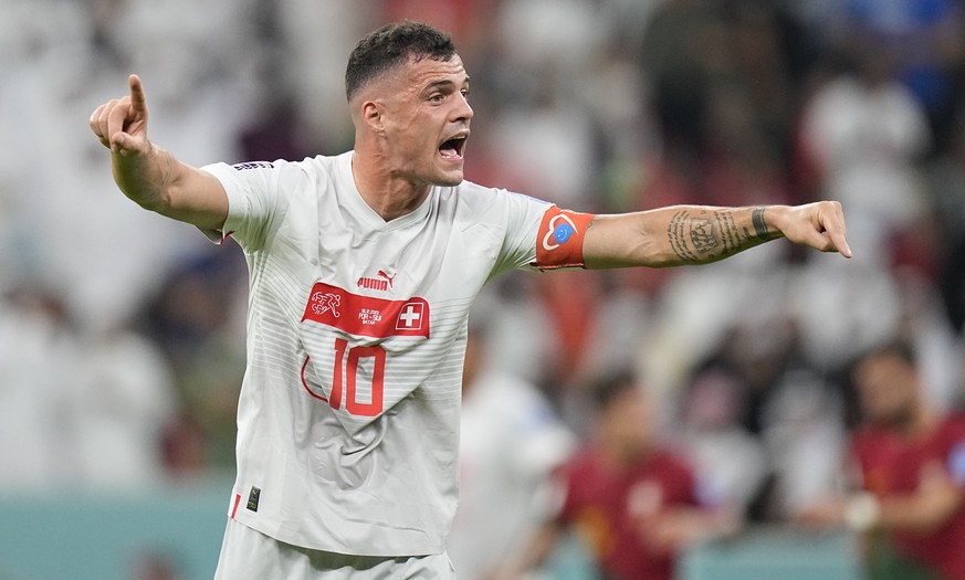 Switzerland's Granit Xhaka gestures during the World Cup round of 16 soccer match between Portugal and Switzerland, at the Lusail Stadium in Lusail, Qatar, Tuesday, Dec. 6, 2022. (AP Photo/Pavel Golov ...