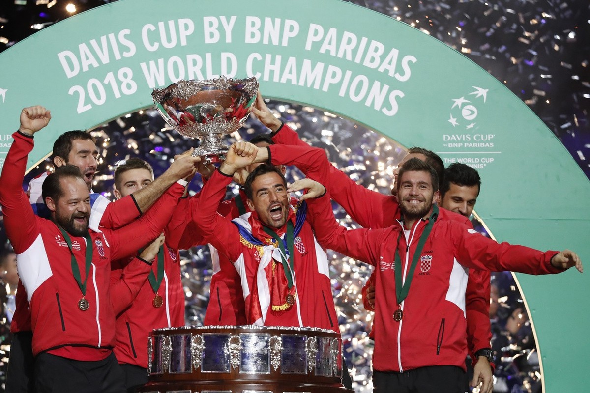 Croatia's team captain Zeljko Krajan, left, and players lift up the cup after the team won the Davis Cup final between France and Croatia Sunday, Nov. 25, 2018 in Lille, northern France. Croatia  ...
