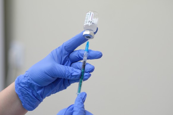 epa09006573 A nurse prepares to administer the Astra Zeneca COVID-19 vaccine at the Municipal Hospital in Sosnowiec, southern Poland, 12 February 2021. Poland received 141,000 doses of the AstraZeneca ...