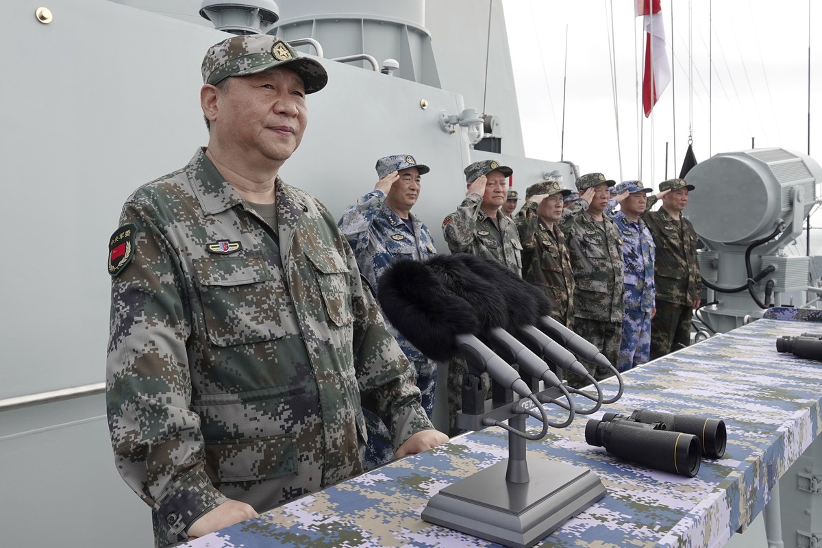 FILE - In this April 12, 2018, file photo released by Xinhua News Agency, Chinese President Xi Jinping speaks after reviewing the Chinese People's Liberation Army (PLA) Navy fleet in the South Ch ...