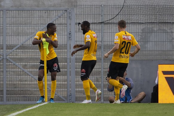 Young Boys&#039; midfielder Christopher Martins, left, celebrates his goal past teammates midfielder Nicolas Moumi Ngamaleu, center, and midfielder Michel Aebischer, right, after scoring the 0:1, duri ...