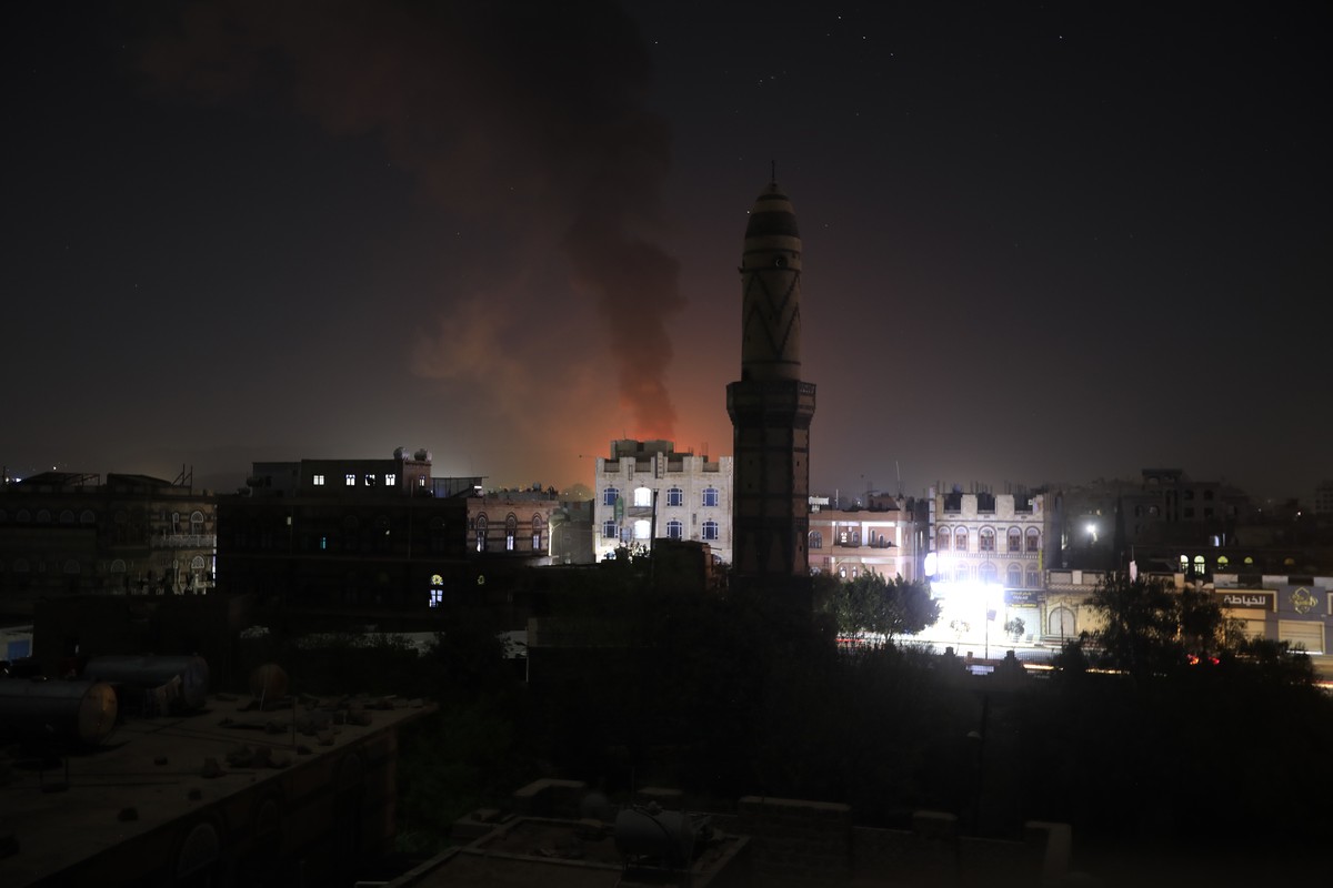 epa11179309 Smokes rise from a Houthi position following US and UK strikes in Sana'a, Yemen, 24 February 2024. The US and Britain conducted new strikes against Yemen's Houthi positions in th ...