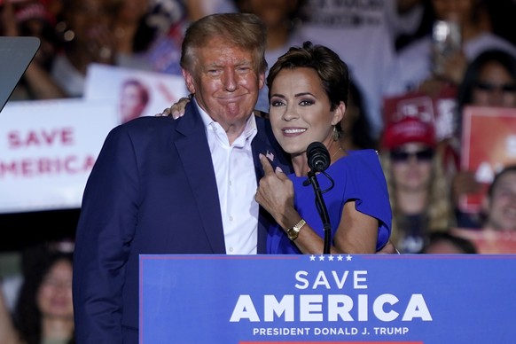 FILE - Arizona Republican gubernatorial candidate Kari Lake, right, speaks as former President Donald Trump listens during a rally, Oct. 9, 2022, in Mesa, Ariz. (AP Photo/Matt York, File)
Kari Lake,Do ...