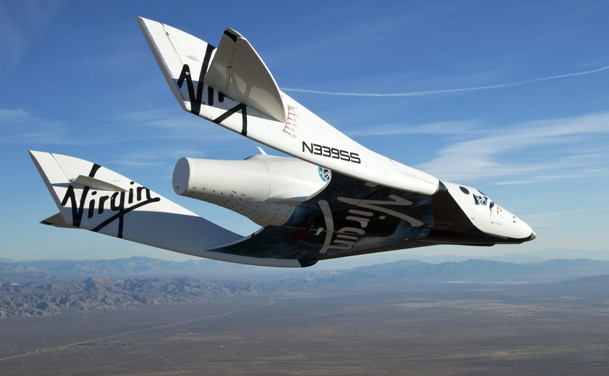 epa04471525 (FILE) An archive handout photo obtained on 11 October 2010 from Virgin Galactic shows SpaceShip2 (VSS Enterprise) as it glides toward Earth on its first test flight after release from the ...