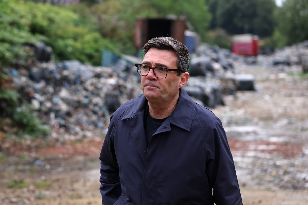 Britain's Prime Minister Andy Burnham views an illegal rubbish dump near the Bradford City football ground in Bradford, England, Thursday, Aug. 20, 2026, to announce a new crackdown on illegal wa ...