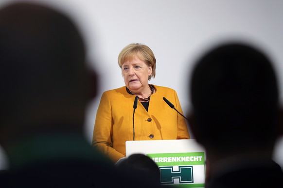 epa07903946 German Chancellor Angela Merkel speaks during a visit to construction equipment company Herrenknecht, a producer of heavy tunnel boring machines, in Schwanau, Germany, 07 October 2019. EPA ...