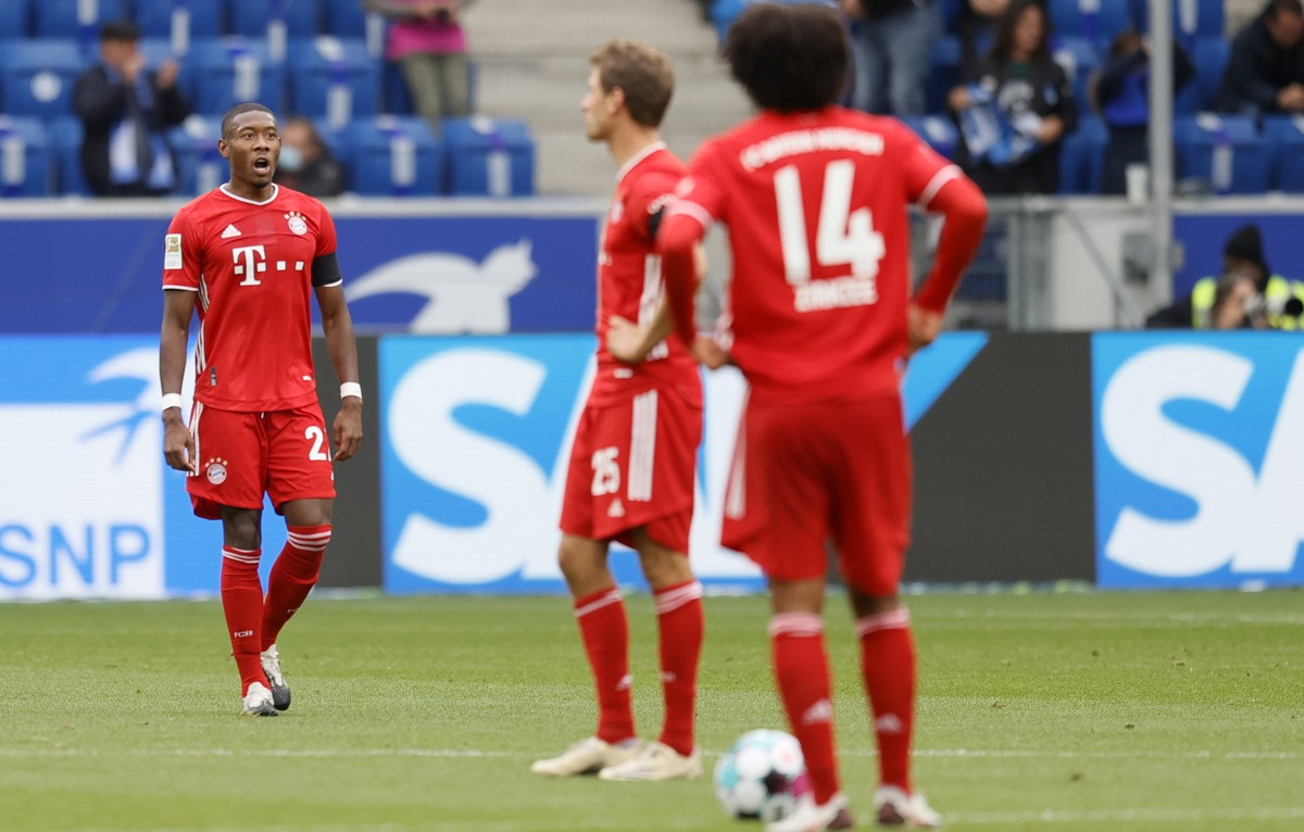epa08701479 Bayern's David Alaba (L) reacts during the German Bundesliga soccer match between TSG 1899 Hoffenheim and FC Bayern Munich in Sinsheim, Germany, 27 September 2020. EPA/RONALD WITTEK C ...