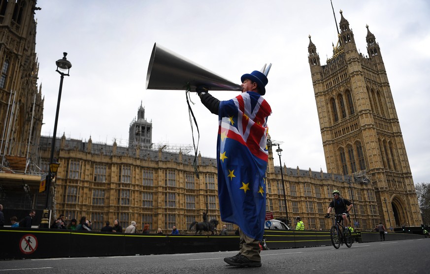 epa07466953 A pro EU campaigner outside the British Parliament in Westminister, central London, Britain, 27 March 2019. The British Houses of Parliament are due to hold a number of indicative votes on ...