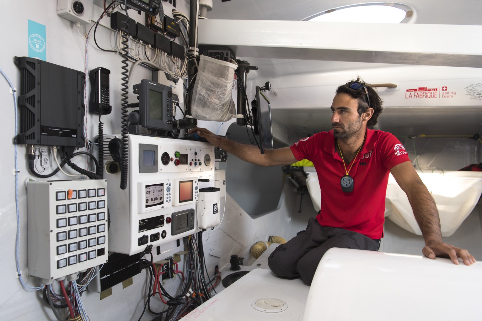 Swiss skipper Alan Roura works on his 60-foot monohull IMOCA &quot;La Fabrique&quot; SUI7 during a training session two months before the start of the Route du Rhum sailing race, at the western French ...