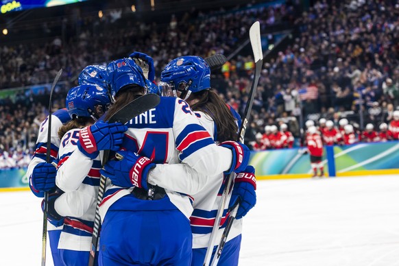 USA's players celebrate their goal after scoring the 0:4, during the women's group A preliminary round game between Switzerland and United States at the 2026 Olympic Winter Games, in Milan S ...