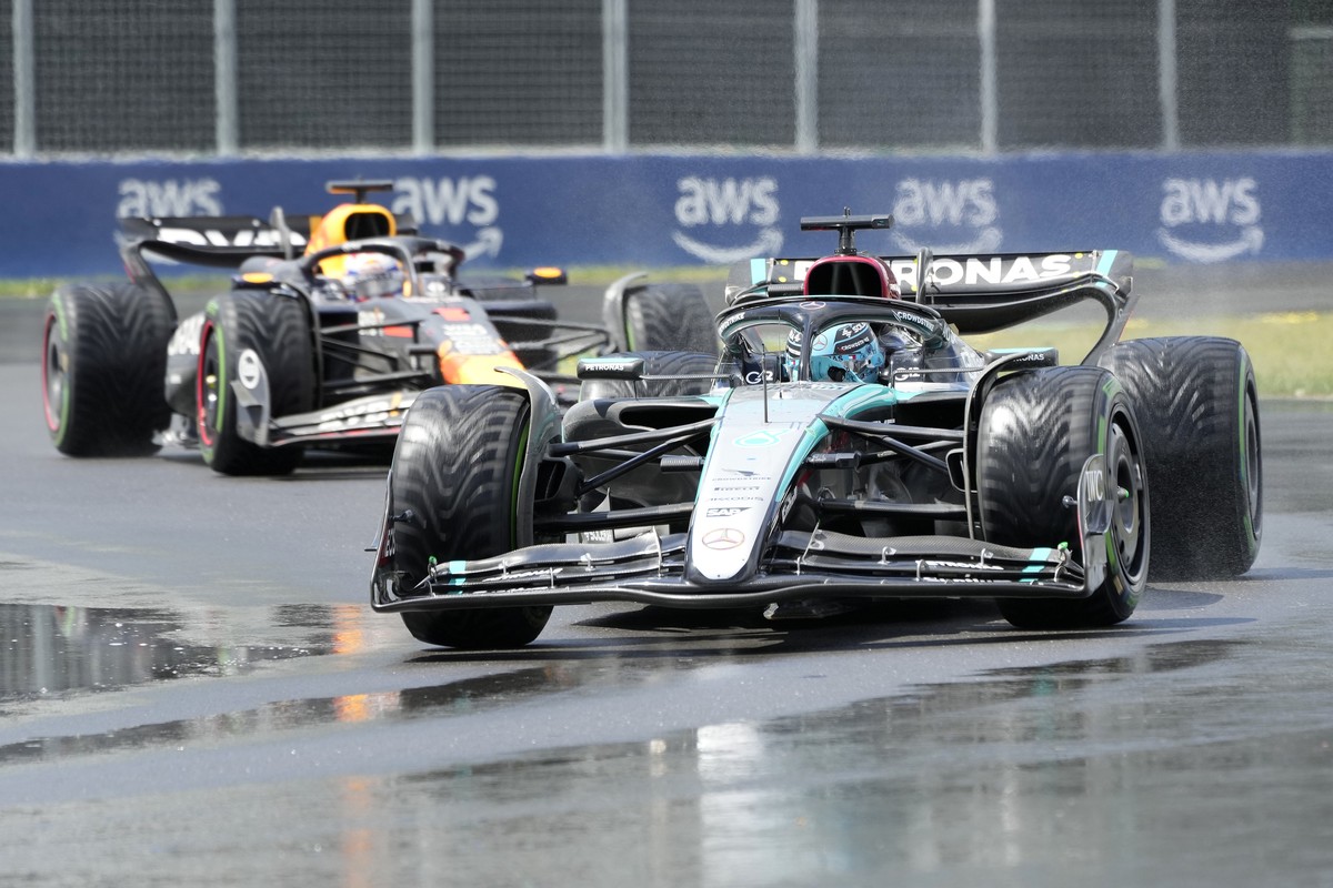 Mercedes driver George Russell, right, of the United Kingdom, leads as Red Bull driver Max Verstappen, of the Netherlands, follows during the Canadian Grand Prix Formula 1 car race, in Montreal, Sunda ...