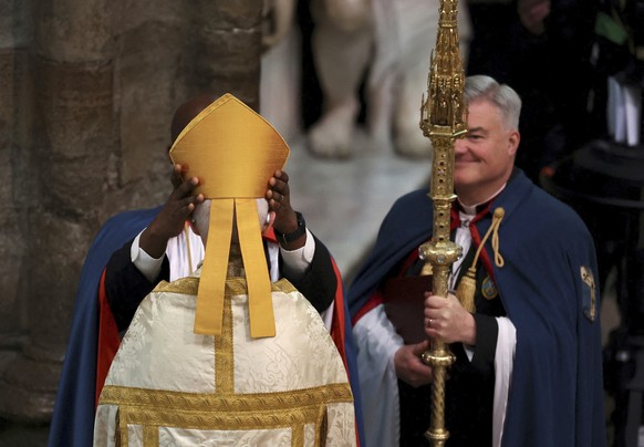 The mitre is placed on the head of the Archbishop of Canterbury Justin Welby ahead of Britain&#039;s King Charles III and Queen Consort Camilla&#039;s coronation ceremony, at Westminster Abbey, in Lon ...