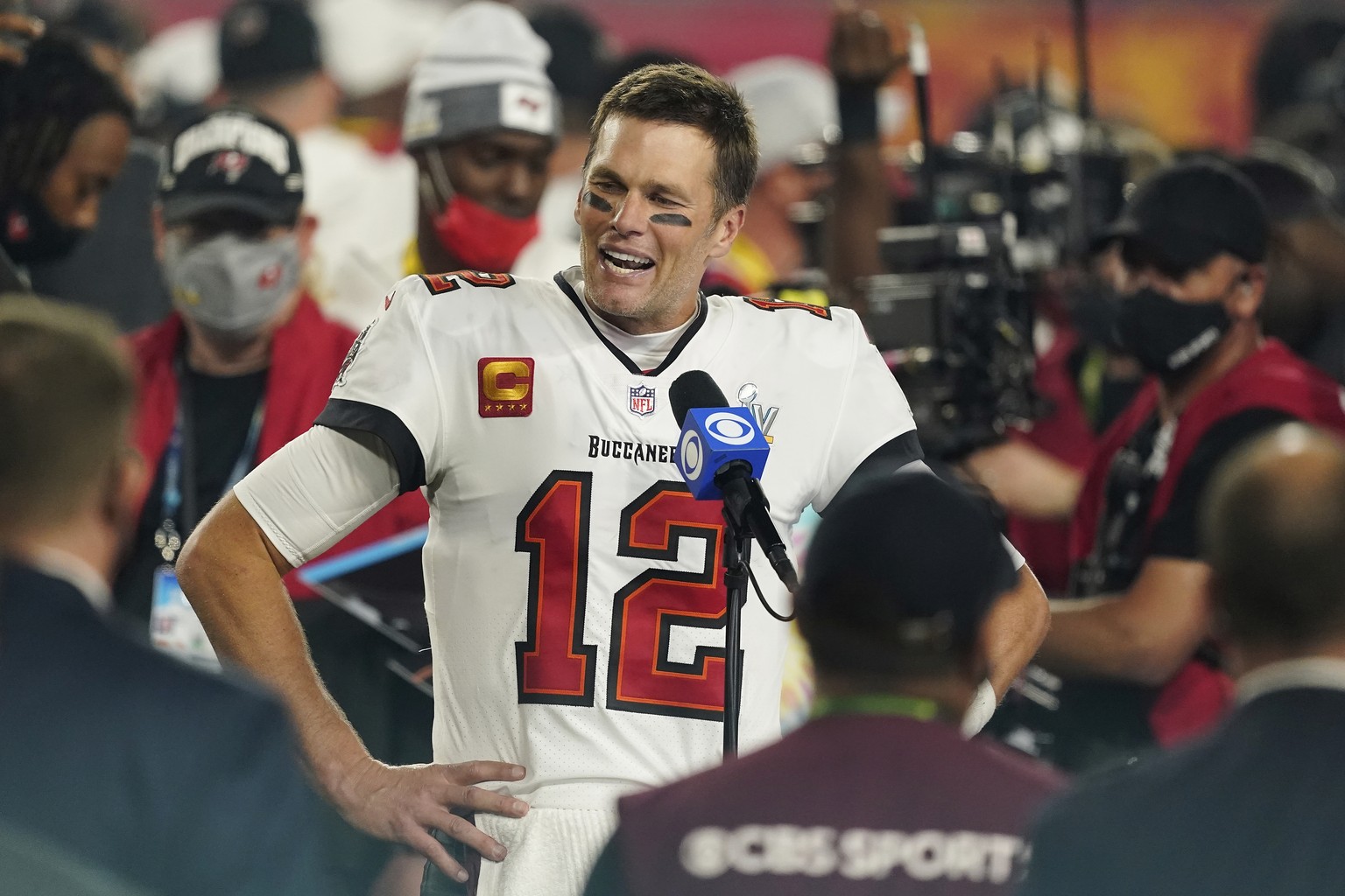 FILE - Tampa Bay Buccaneers quarterback Tom Brady (12) is interviewed on the field after the NFL Super Bowl 55 football game against the Kansas City Chiefs, in Tampa, Fla., Sunday, Feb. 7, 2021. Thank ...
