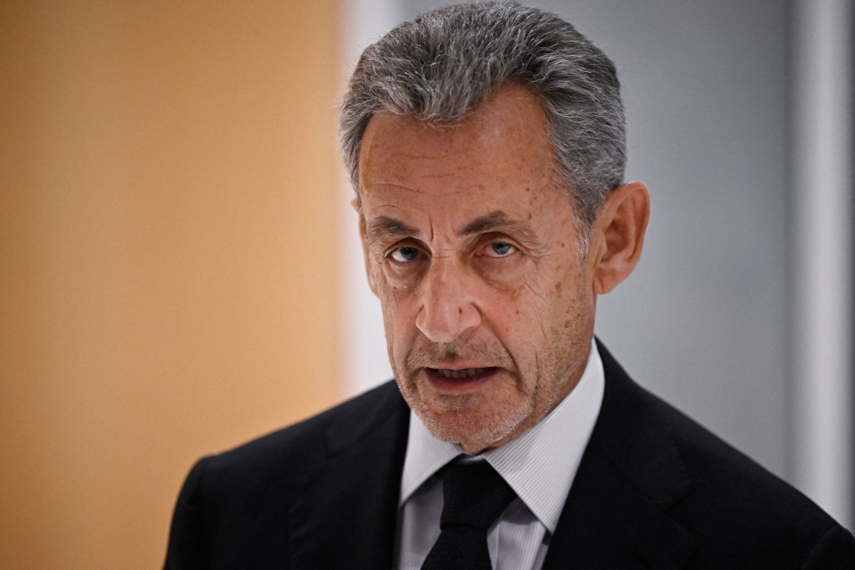 (FILES) Former French president Nicolas Sarkozy leaves after the verdict in his trial for illegal campaign financing from Libya for his successful 2007 presidential bid, at the Tribunal de Paris court ...