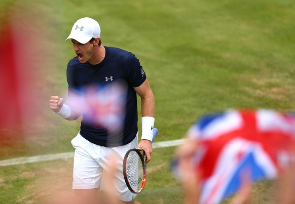 LONDON, ENGLAND - JULY 17: Andy Murray of Great Britain celebrates winning match point against Jo-Wilfried Tsonga of France during Day 1 of the Davis Cup match between Great Britain and France at Quee ...