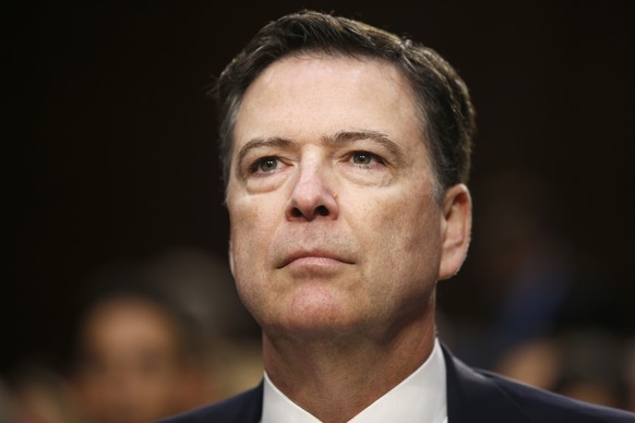 epa12920522 (FILE) - Former Director of the Federal Bureau of Investigation, James Comey delivers his testimony before the Senate Intelligence Committee on the FBI's investigation into the Trump  ...