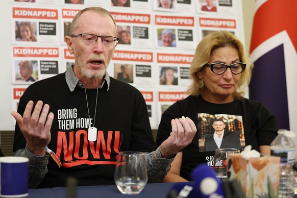 epa10985898 Thomas Hand (L) whose eight year old daughter Emily Hand is believed kidnapped by Hamas and Orit Meir (R) speak at a press conference of family members of Israeli hostages at the Israeli e ...
