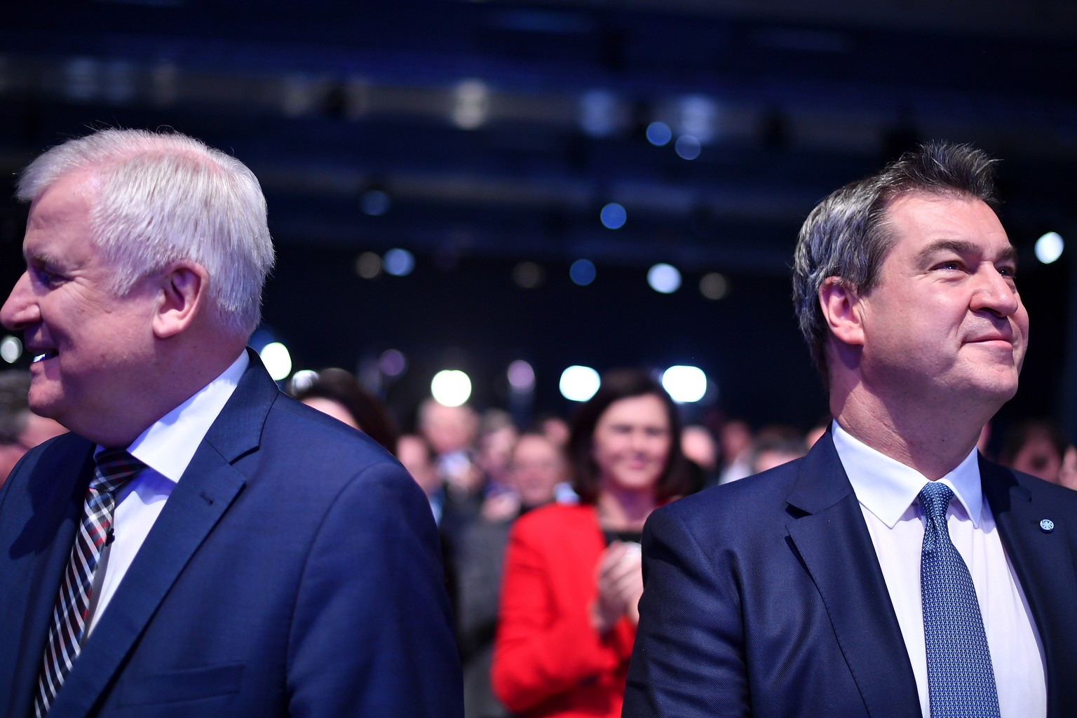 epa07299460 Bavarian Prime Minister Markus Soeder (R) and his predecessor, German Minister of Interior, Construction and Homeland Horst Seehofer (L) look into different directions after Soeder was ele ...