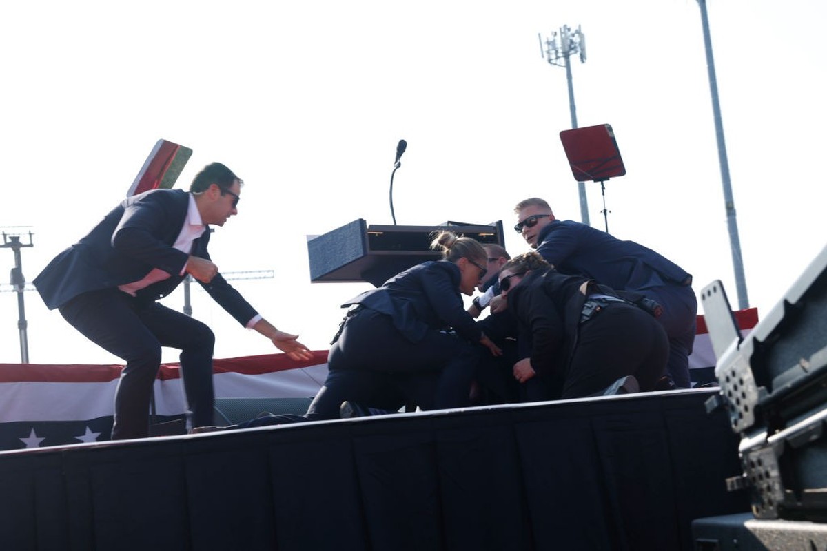 BUTLER, PENNSYLVANIA - JULY 13: Republican presidential candidate former President Donald Trump is rushed offstage during a rally on July 13, 2024 in Butler, Pennsylvania. Butler County district attor ...